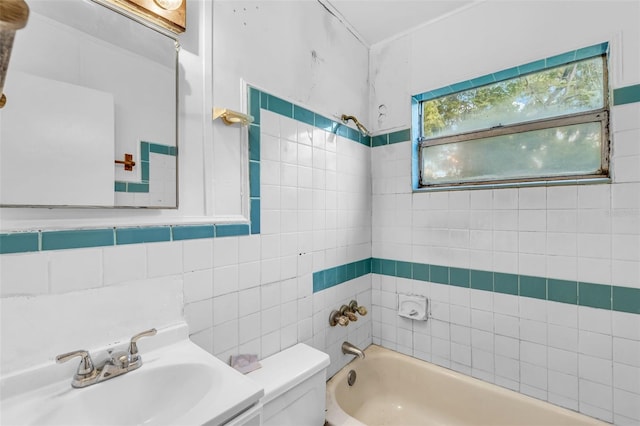 1413 36th St, Orlando, FL 32839 - bathroom with toilet, a sink, and tile walls