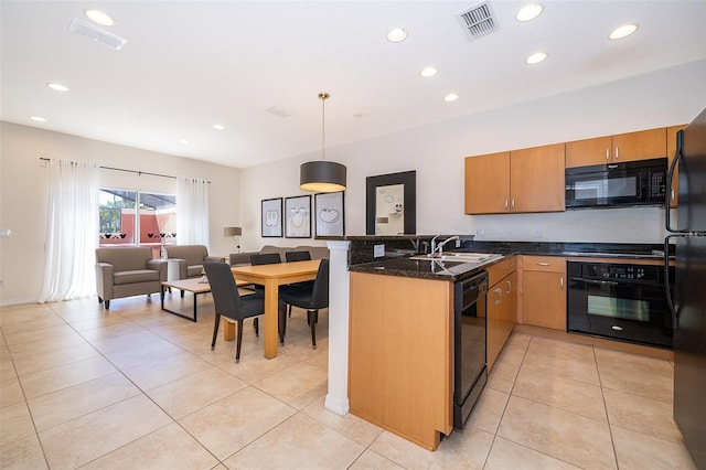 kitchen with light tile patterned flooring, visible vents, black appliances, and a peninsula