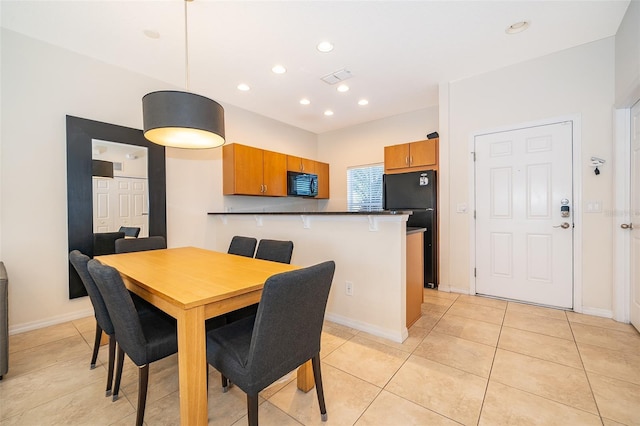 dining area with light tile patterned flooring, baseboards, and recessed lighting