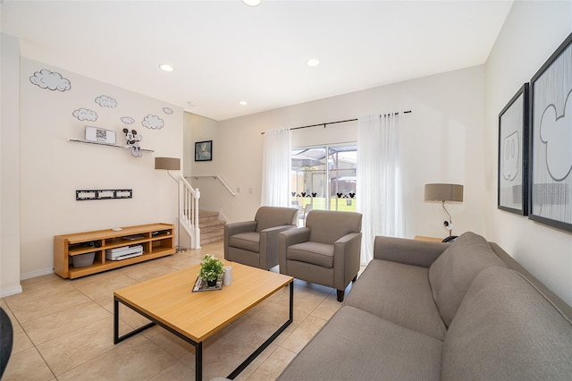 living room with light tile patterned flooring, stairway, and recessed lighting