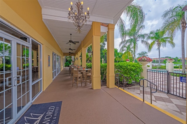 view of patio / terrace featuring french doors, a ceiling fan, and outdoor dining area