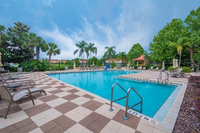 community pool featuring a patio area