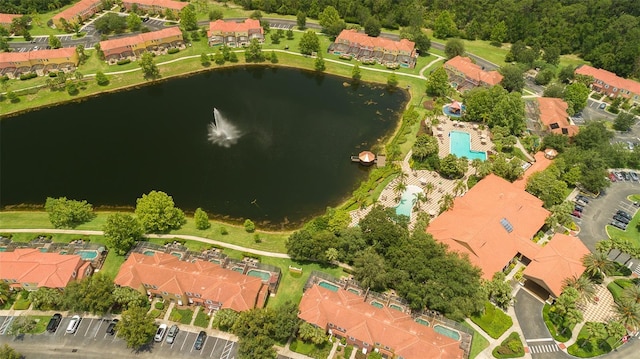 birds eye view of property with a residential view and a water view