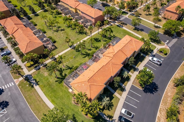 birds eye view of property with a residential view