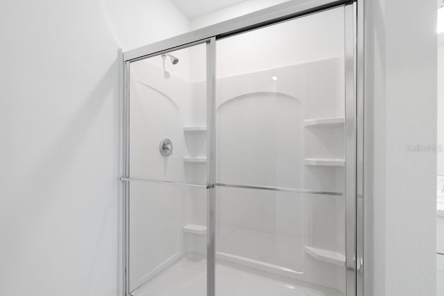 bathroom featuring a stall shower
