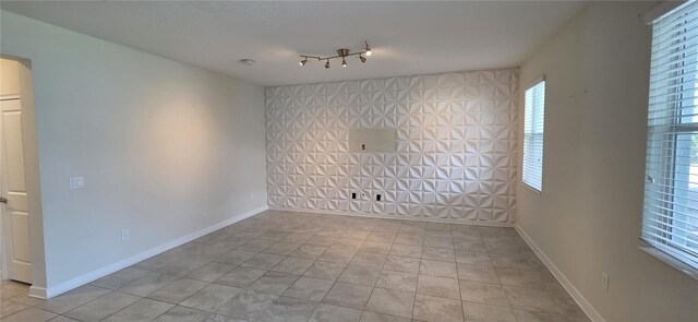 3043 Beaver Creek Dr, Kissimmee, FL 34746 - empty room featuring baseboards and tile patterned floors