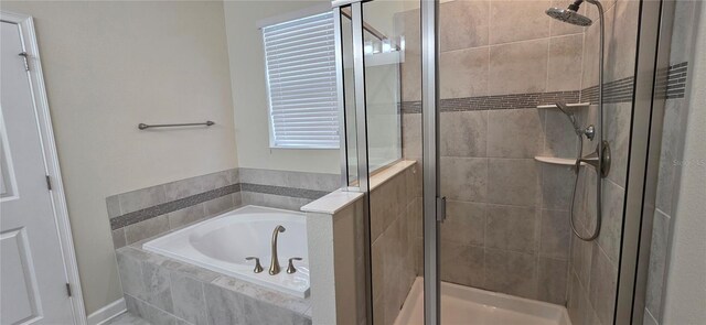 3043 Beaver Creek Dr, Kissimmee, FL 34746 - full bathroom featuring a bath and a shower stall