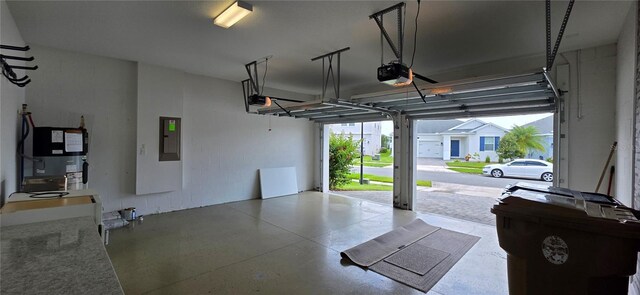 3043 Beaver Creek Dr, Kissimmee, FL 34746 - garage with a garage door opener and electric panel