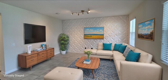 3043 Beaver Creek Dr, Kissimmee, FL 34746 - living room with light tile patterned floors and baseboards