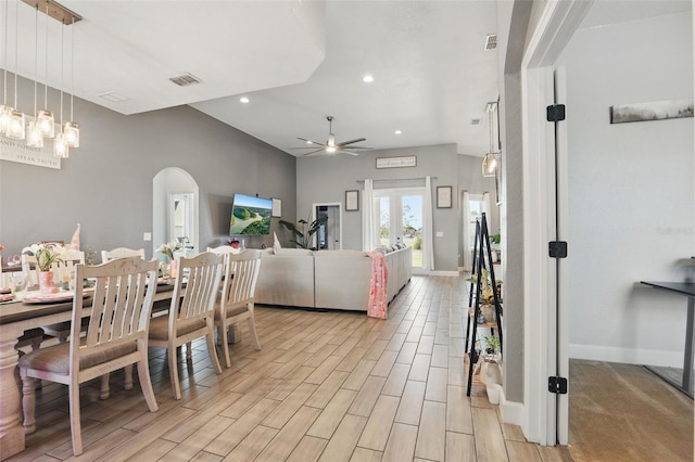 dining space with visible vents, ceiling fan, recessed lighting, arched walkways, and wood tiled floor