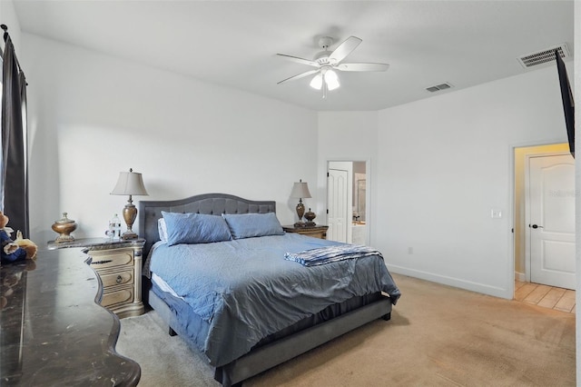 bedroom featuring baseboards, visible vents, a ceiling fan, and light colored carpet