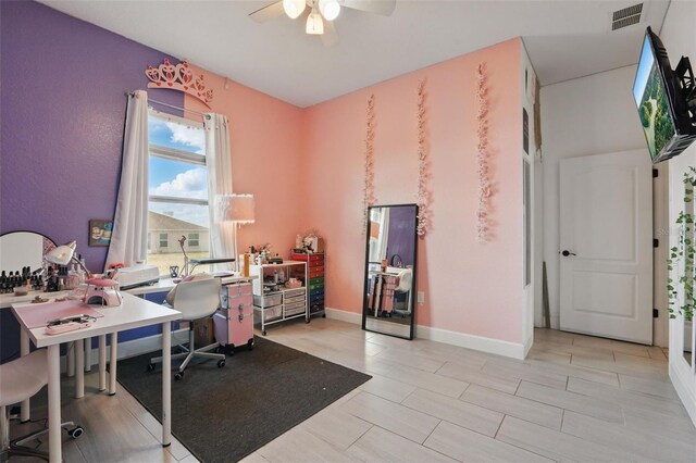 office with baseboards, ceiling fan, and visible vents