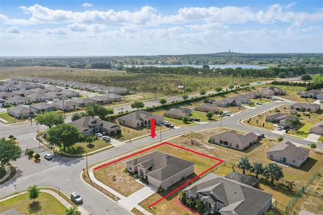 bird's eye view featuring a residential view and a water view