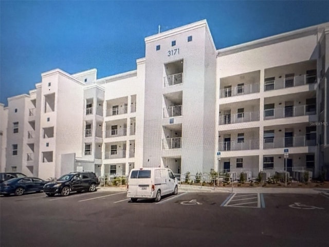 view of property with uncovered parking