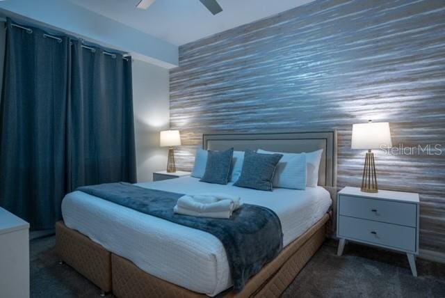 carpeted bedroom featuring a ceiling fan