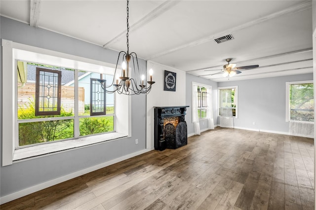 unfurnished dining area with plenty of natural light, hardwood / wood-style flooring, and baseboards