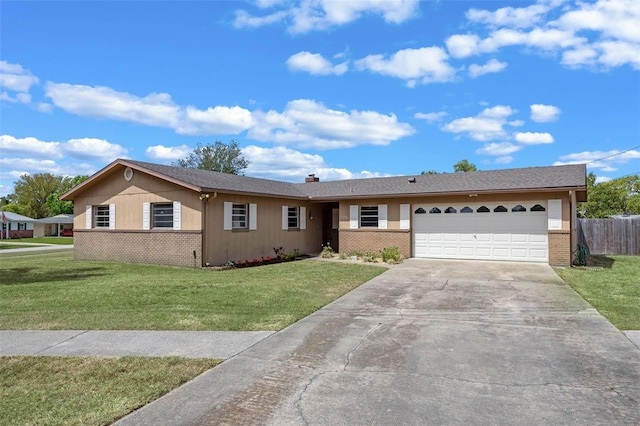 ranch-style house with a front yard, an attached garage, brick siding, and concrete driveway