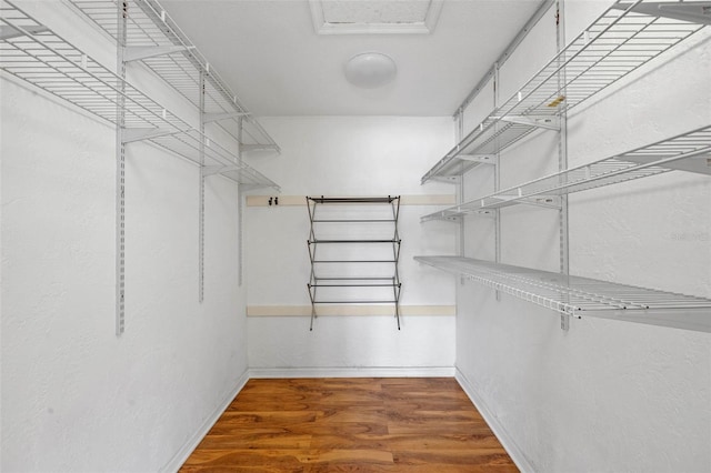 spacious closet with wood finished floors
