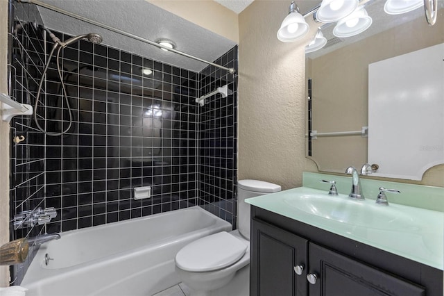 full bath with a textured ceiling, tub / shower combination, toilet, vanity, and a textured wall