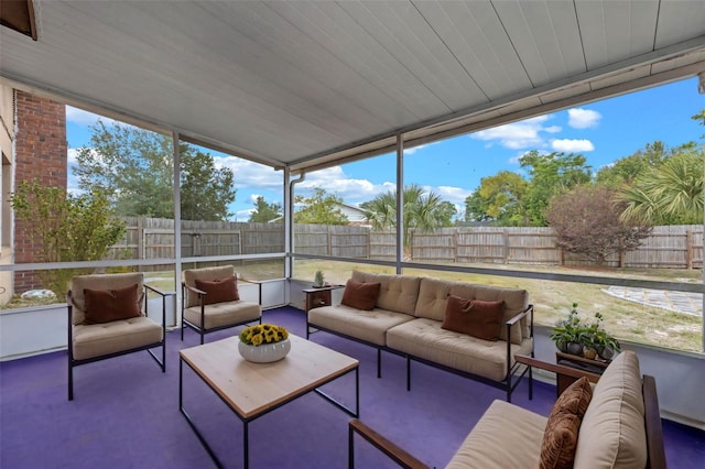 sunroom with an outdoor living space