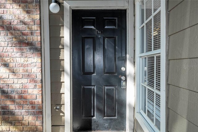 5136 Park Central Dr Unit 212, Orlando, FL 32839 - property entrance with brick siding