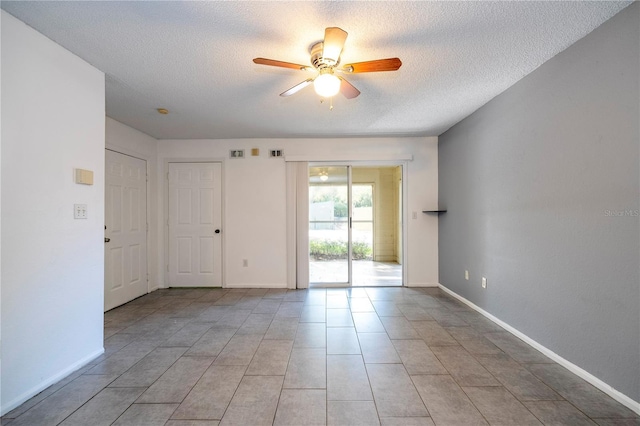 5136 Park Central Dr Unit 212, Orlando, FL 32839 - empty room featuring baseboards, a textured ceiling, and ceiling fan