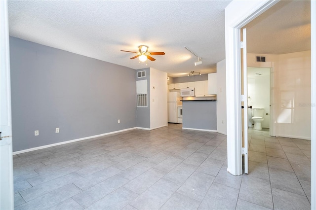5136 Park Central Dr Unit 212, Orlando, FL 32839 - unfurnished living room with ceiling fan, a textured ceiling, visible vents, light tile patterned floors, and track lighting