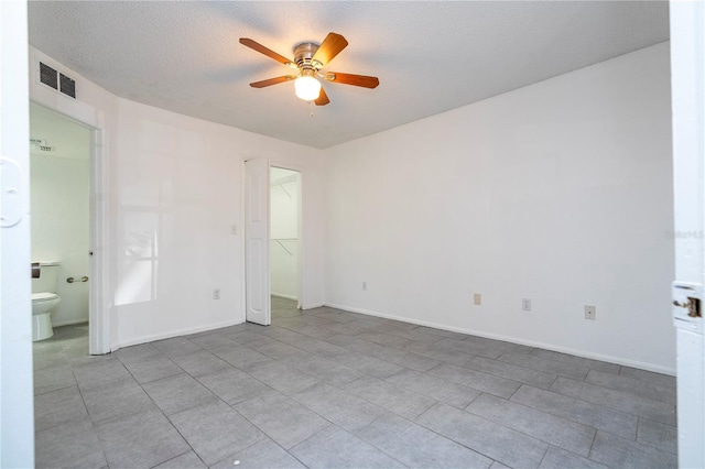 5136 Park Central Dr Unit 212, Orlando, FL 32839 - unfurnished bedroom featuring ceiling fan, visible vents, baseboards, and ensuite bath