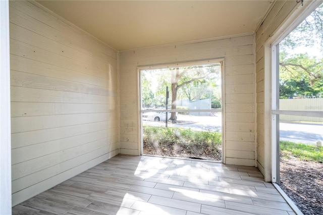 5136 Park Central Dr Unit 212, Orlando, FL 32839 - interior space with light wood finished floors and wooden walls