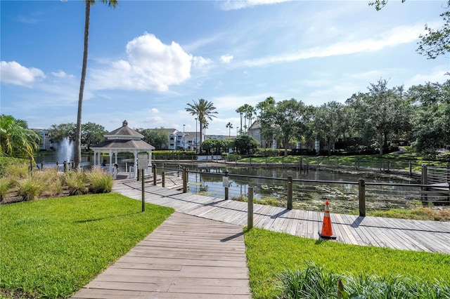 5136 Park Central Dr Unit 212, Orlando, FL 32839 - dock area with a water view, a gazebo, and a yard