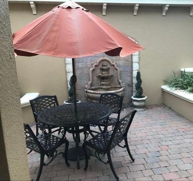 view of patio featuring outdoor dining space