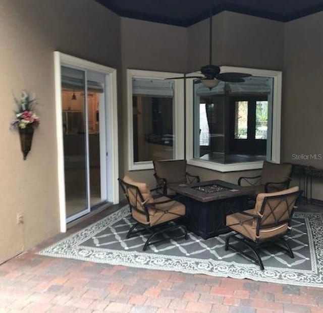 view of patio featuring a ceiling fan