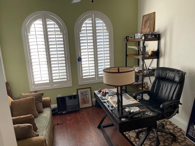 office with baseboards and wood finished floors