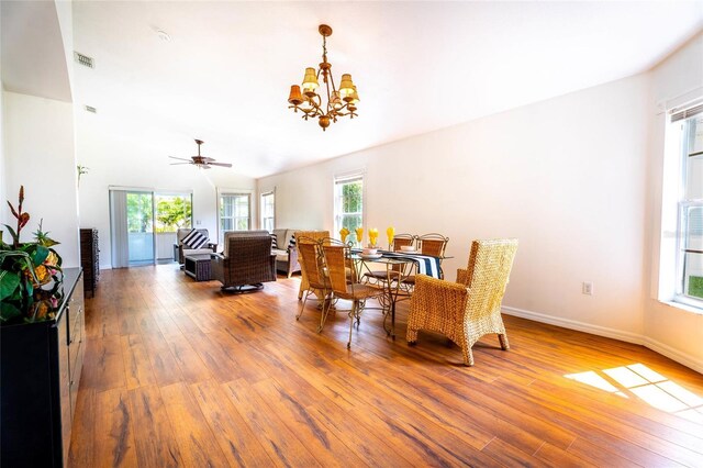 151 Bell Tower Xing W, Kissimmee, FL 34759 - dining space featuring healthy amount of natural light, wood-type flooring, and a chandelier