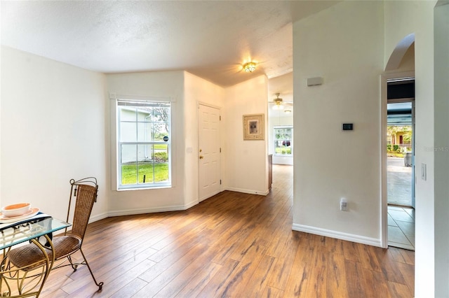 151 Bell Tower Xing W, Kissimmee, FL 34759 - dining area featuring arched walkways, plenty of natural light, and wood finished floors