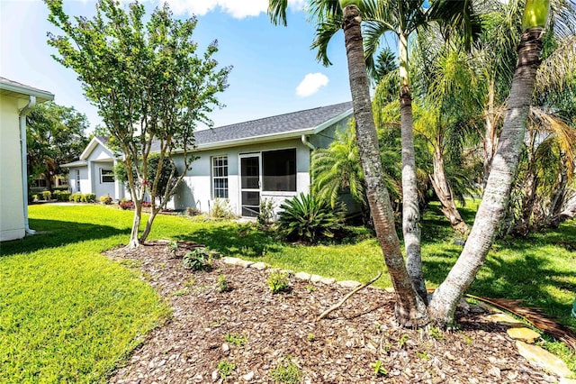 151 Bell Tower Xing W, Kissimmee, FL 34759 - rear view of property with a yard and stucco siding