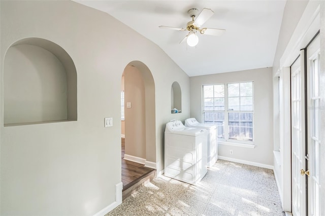 washroom with laundry area, arched walkways, a ceiling fan, washer and dryer, and baseboards