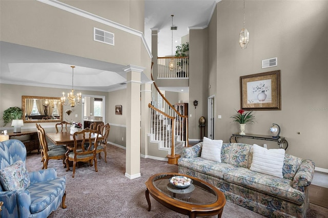 3033 Zaharias Dr, Orlando, FL 32837 - living room featuring visible vents, carpet flooring, a chandelier, and stairs