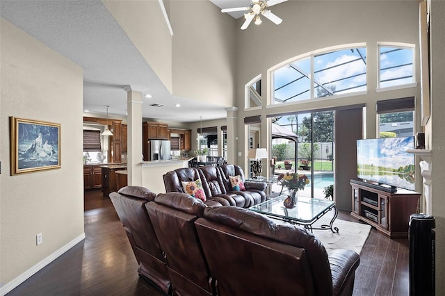 3033 Zaharias Dr, Orlando, FL 32837 - living room featuring baseboards, ceiling fan, dark wood-style floors, recessed lighting, and ornate columns