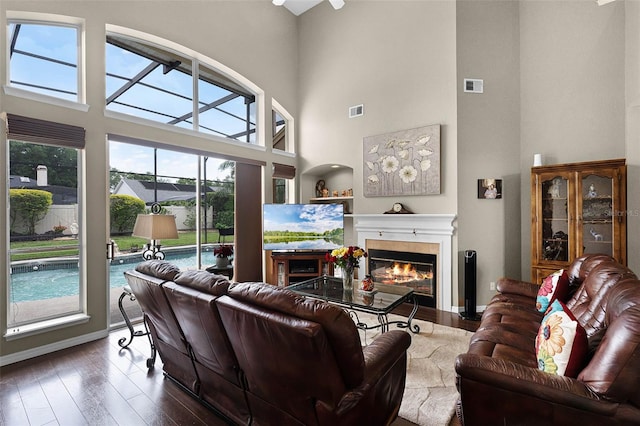 3033 Zaharias Dr, Orlando, FL 32837 - living room featuring baseboards, wood finished floors, a fireplace, and visible vents