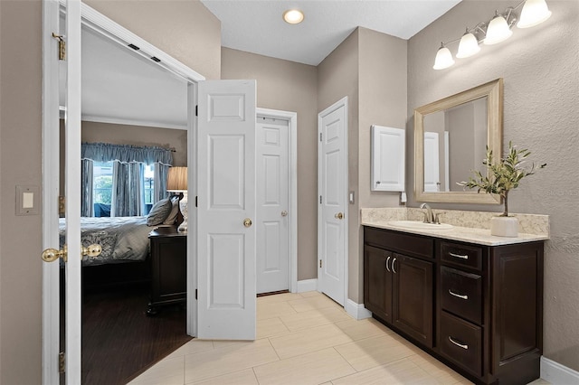 3033 Zaharias Dr, Orlando, FL 32837 - ensuite bathroom with vanity, ensuite bath, and baseboards