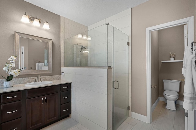 3033 Zaharias Dr, Orlando, FL 32837 - full bathroom featuring a textured ceiling, vanity, tile patterned flooring, toilet, and a stall shower