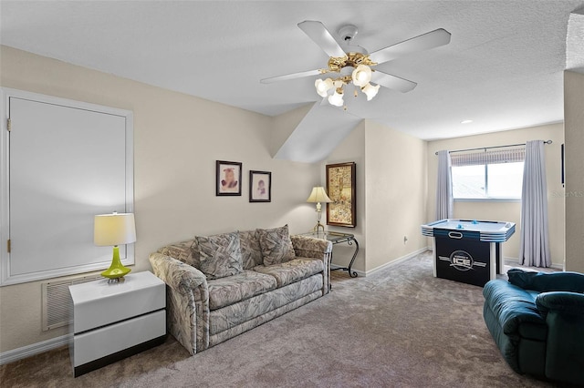 3033 Zaharias Dr, Orlando, FL 32837 - living room featuring baseboards, a ceiling fan, carpet flooring, and a textured ceiling