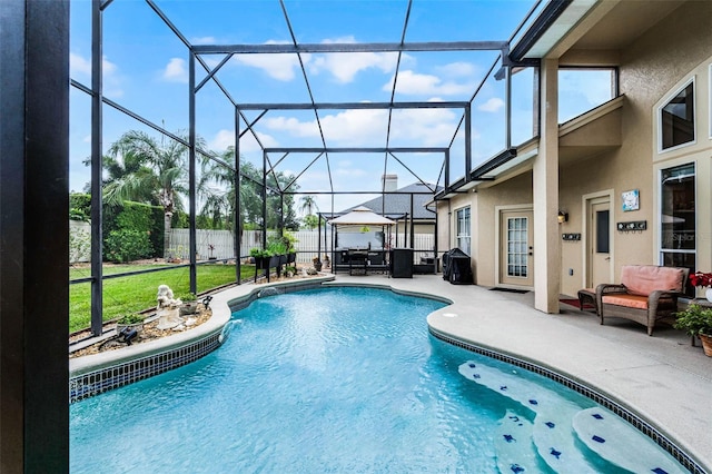 3033 Zaharias Dr, Orlando, FL 32837 - view of swimming pool with a patio area, a fenced backyard, an outdoor living space, and glass enclosure