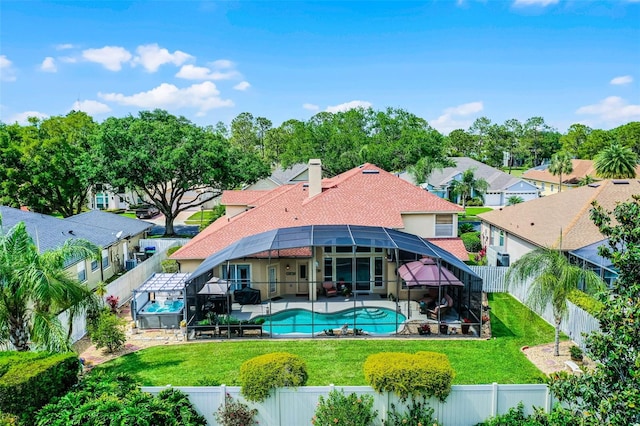 3033 Zaharias Dr, Orlando, FL 32837 - rear view of property featuring a patio, a fenced backyard, and glass enclosure
