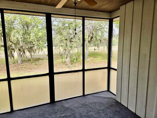 5 Buck Cir # B5, Haines City, FL 33844 - unfurnished sunroom featuring a ceiling fan