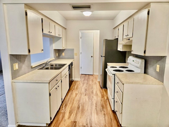 5 Buck Cir # B5, Haines City, FL 33844 - kitchen featuring under cabinet range hood, light countertops, white range with electric cooktop, and a sink