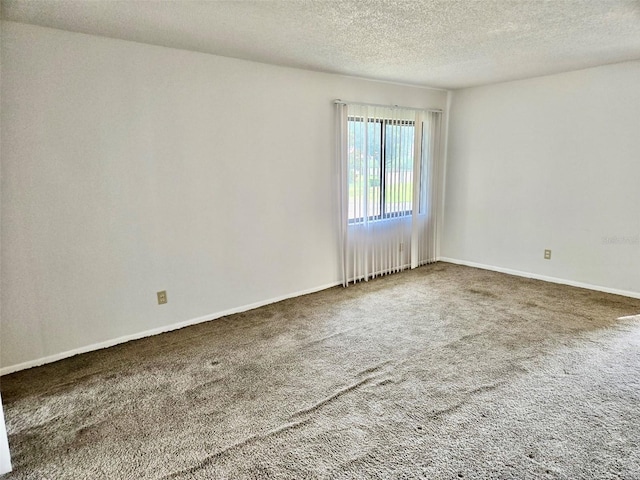 5 Buck Cir # B5, Haines City, FL 33844 - unfurnished room with a textured ceiling, carpet floors, and baseboards