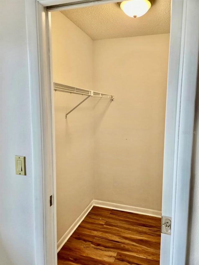 5 Buck Cir # B5, Haines City, FL 33844 - walk in closet with dark wood-type flooring