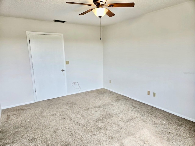 5 Buck Cir # B5, Haines City, FL 33844 - spare room with a ceiling fan, a textured ceiling, baseboards, carpet flooring, and visible vents